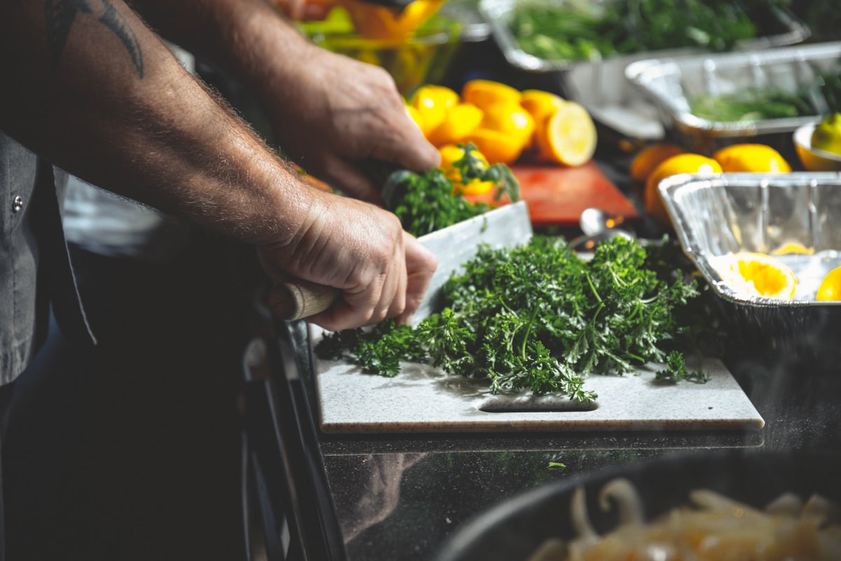 Men preparing and sharing healthy meals together in a modern kitchen